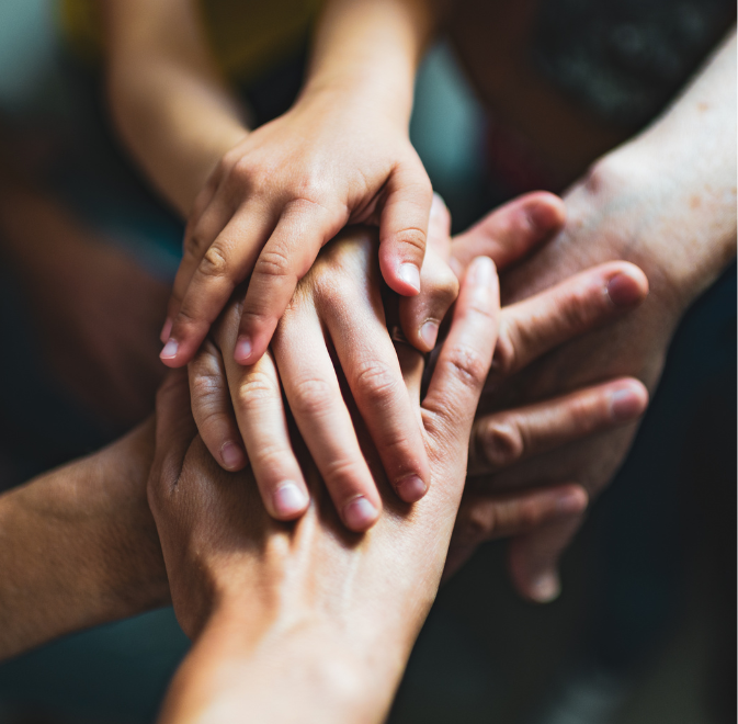 People coming together, hand in hand, working in unity.